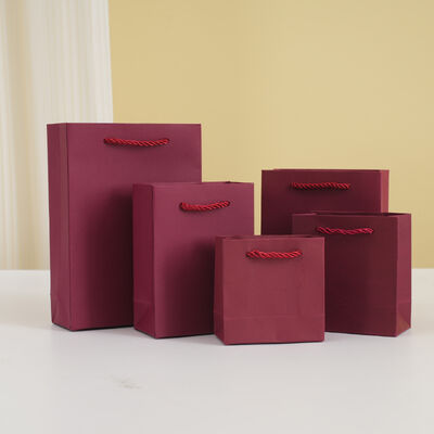 Buy Custom Specialty Paper Clothing Store Tote Bags Gift Shopping Packaging Bags Free Printed Logo online manufacture