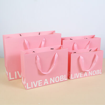 comprar Bolsas de presente de papel espessado Bolsas de roupas de loja Bolsas Tote Bolsas de impressão de logotipo personalizado Bolsas de embalagem online manufacture