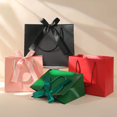 Buy Luxury Solid Color Gift Bags Premium Kraft Paper Shopping Totes with Ribbon Handles Bulk Stock for Cross Border Trade Ideal for Gifting Retail Packaging online manufacture